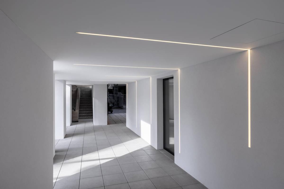 Concrete recessed linear profile lighting in architecture